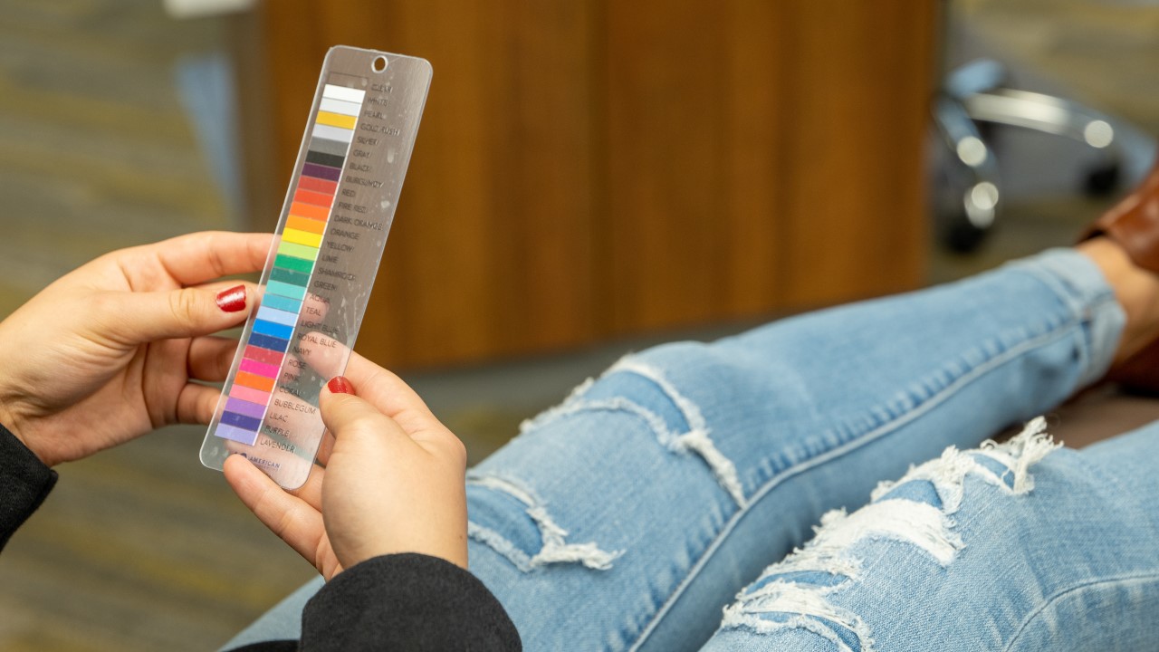 Patient Choosing Elastic Colors At Fort Wayne Indiana Orthodontic Office